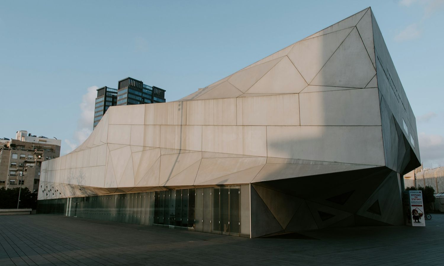 Exterior of the Tel Aviv Museum of Art's Herta and Paul Amir Building, featuring its distinctive angular architecture and geometric concrete facade.
